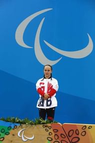 RIO DE JANEIRO, BRAZIL - SEPTEMBER 09:  Gold medalist Ellie Robinson of Great Britain celebrates on the podium at the medal ceremony for the Women's 50m Butterfly - S6 on day 2 of the Rio 2016 Paralympic Games at the Olympic Aquatics Stadium on September 9, 2016 in Rio de Janeiro, Brazil.  (Photo by Friedemann Vogel/Getty Images)